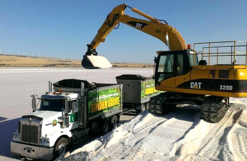 garden-groove-trucks-being-loaded-by-a-digger