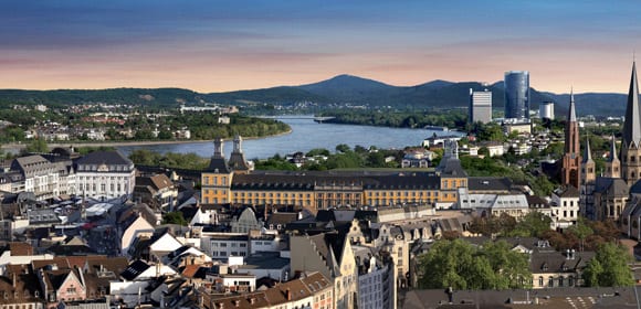 City skyline of Bonn with river and mountains in background