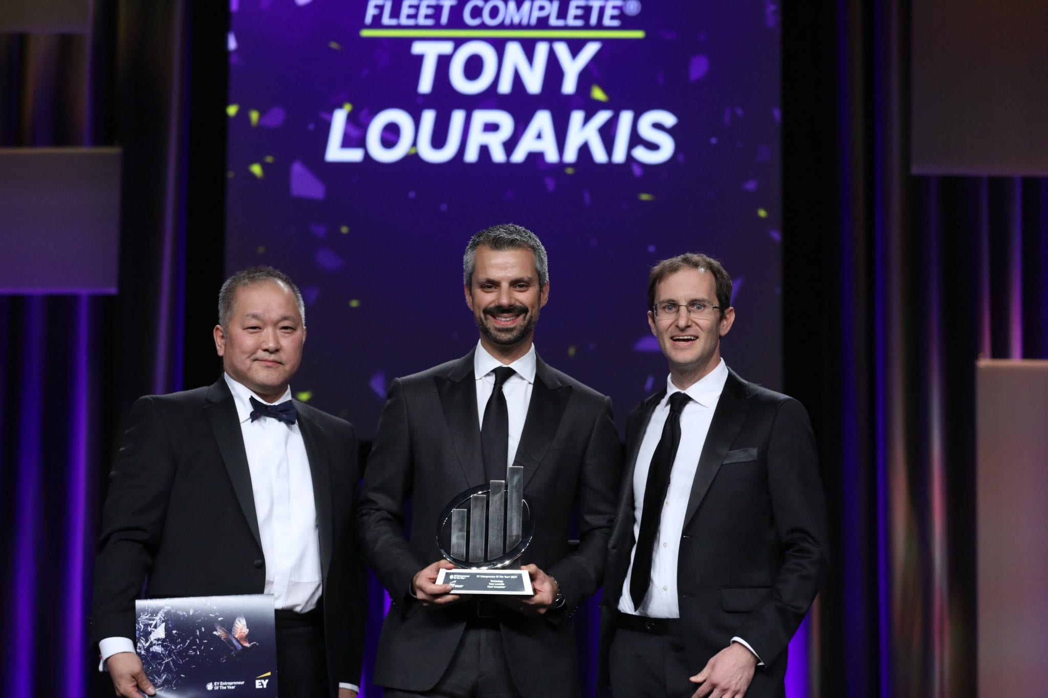 Tony Lourakis receiving EY award